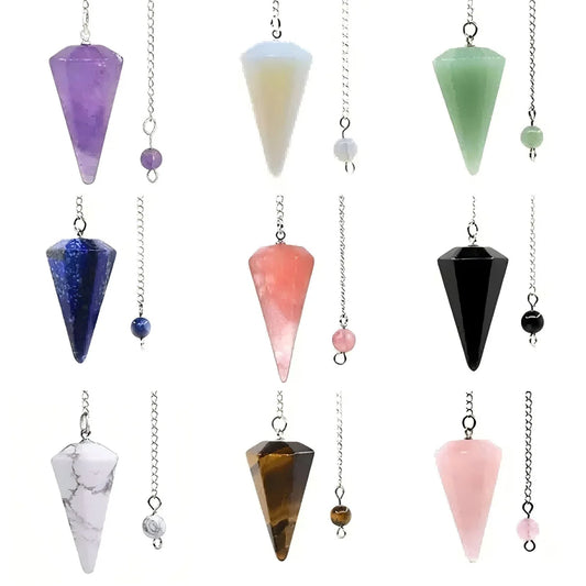 Collection of colorful crystal pendulums on a white background